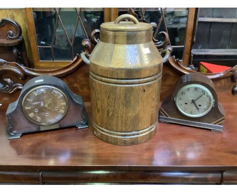 A large oak milk churn together with 2 wooden eight-day timer mantel clocks complete with keys 
