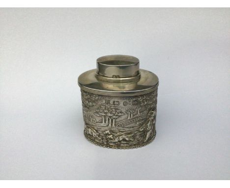 A Victorian Silver Tea Caddy by George Nathan &amp; Ridley Hayes, with repousse decoration of putti in a landscape hunting bo