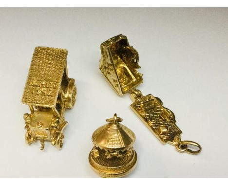 Three 9ct yellow gold novelty charms, including a vintage Daimler car, a moving carousel and a house with hinged roof, total 