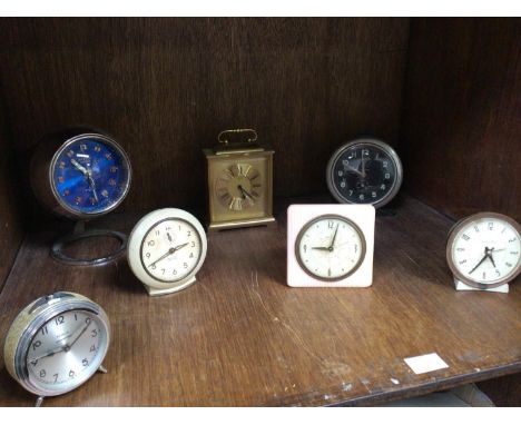 A collection of seven assorted vintage alarm clocks including a Presta Saturn, a SWIZA 8 and a Junghans Repetition etc. 