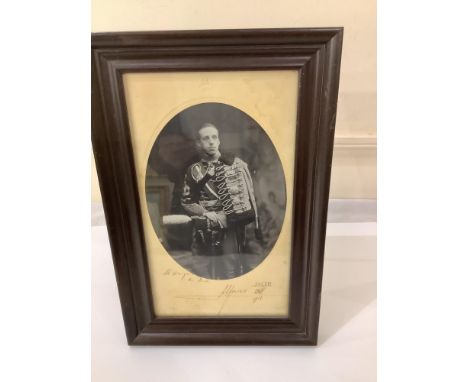A signed oval monochrome three-quarter-length portrait of King Alfonso XIII of Spain, inscribed in his hand to the Spanish Am