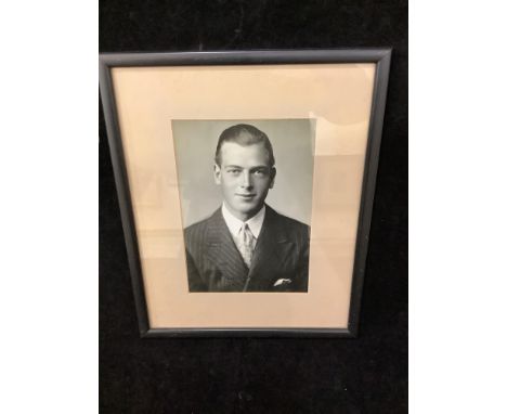 A signed monochrome head and shoulders portrait of HRH Prince George Duke of Kent (1902-1942), son of George V and Queen Mary