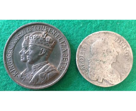 A box of mixed coins with a few interesting pieces and a 1997 British coins market value book. The box mainly has various bag