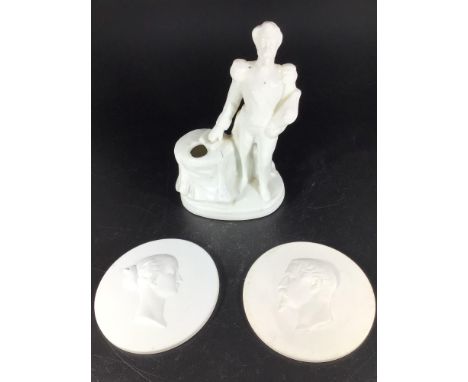 A 19th century blanc-de-chine porcelain figural inkwell and pen stand modelled as the French Emperor Napoleon III, 14cm high,