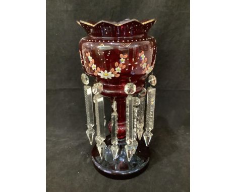 A large Victorian ruby glass lustre, with gilded and hand-painted floral decoration and prismatic drops, 37cm tall 