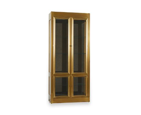 MasterCraft, United States. A brass and glass display cabinet or vitrine with smoked glass back, one of two in this auction. 