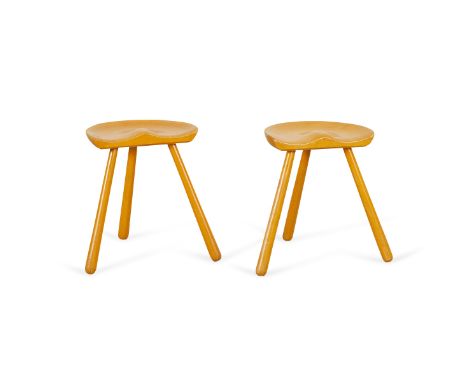 Arne Hovmand-Olsen (Danish, 1919-1989). Pair of wooden milking stools. Tri-pod legs with rounded feet and sculpted seats.Each