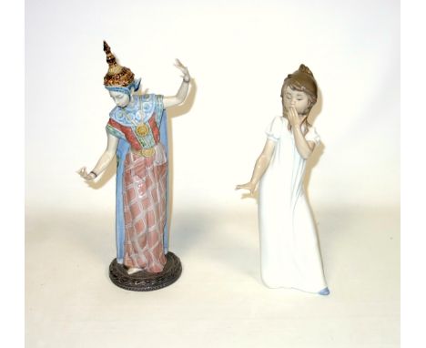 Lladro figure of a female Thai dancer, model No.5593, H.33cm, and a Nao figure of a girl, H.29cm. (2)Condition: Both good con