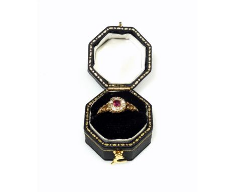 18ct diamond and ruby cluster ring stamped 18ct, set old cut ruby and diamonds, ring size N 1/2, boxed, 2.7 grams (2) Conditi