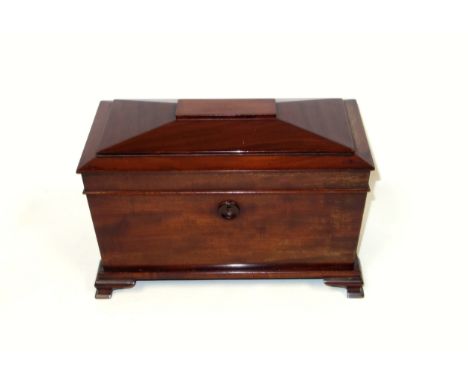 Victorian mahogany tea caddy of sarcophagus form, the interior with 2 removable boxes flanking a central well, on bracket fee