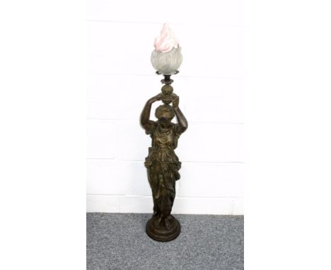 Late 19th Century French spelter figure of a woman wearing draped costume, her arms held above her head, standing on a circul