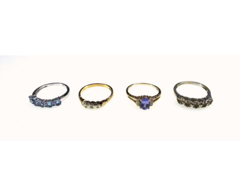 9ct white gold ring set 5 blue stones, 9ct ring set blue stone, 9ct ring with 3 illusion set diamonds, and another 9ct ring, 