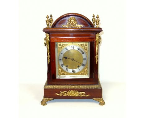 Edwardian Regency style mantel clock with a brass dial, silvered chapter ring and Roman numerals enclosing an 8 day movement 