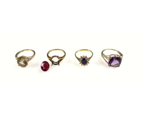 Yellow metal blue stone and white stone ring, 9ct gold citrine ring, 9ct amethyst ring, and a 9ct garnet ring, (stone loose),