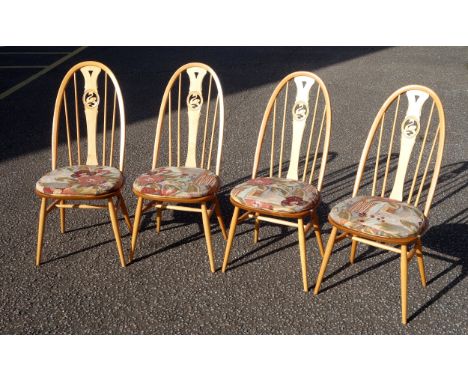 Ercol set of 4 Swan back Windsor dining chairs, with upholstered cushion attached by strap and popper, each  100cm high. (4) 