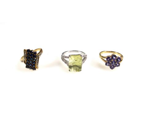 9ct gold triple row sapphire and diamond ring, 9ct blue stone cluster ring, and a 9ct citrine and diamond ring. (3)