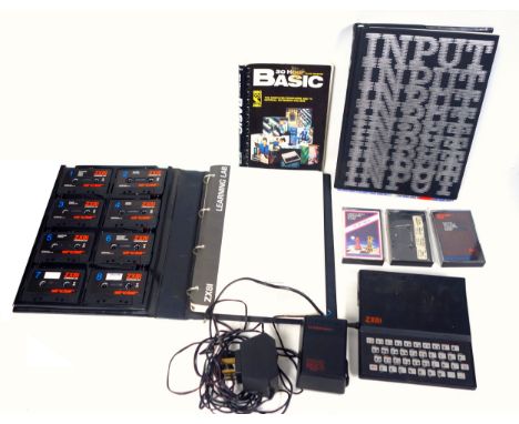 Sinclair ZX81 computer with power adaptor, 3 cassettes: 'Maths Balance Volumes Averages Bases Temp', '1k ZX Chess', and a com