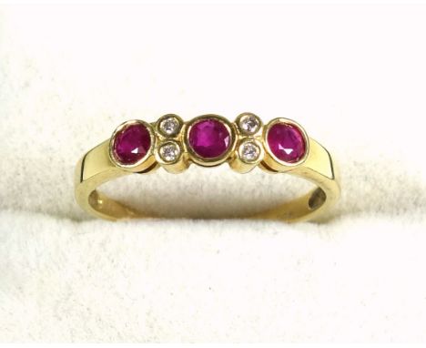 18k gold, ruby and diamond ring, size Q 1/2, set three rubies and four small diamonds, 2.4 grams approx. 