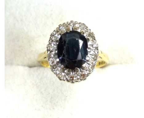 18ct gold ring set sapphire within a band of 14 illusion diamonds, size M, London, 1968, 3.9grs