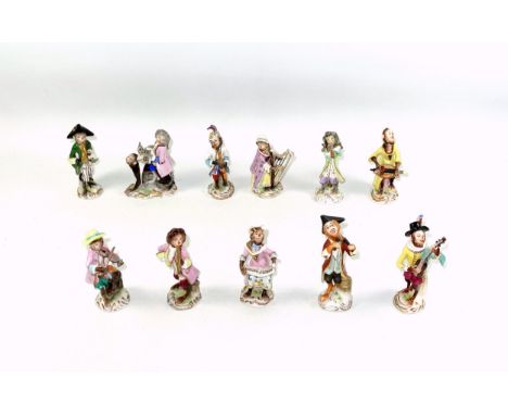 Early 20th Century Volkstedt porcelain 9 piece monkey orchestra or band of musicians, including pianist, harpist, bassoonist,