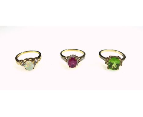 9ct gold ring set ruby and diamonds, 9ct ring set diamonds and lime green stone, and a 9ct ring set opal and diamonds, 8.8grs