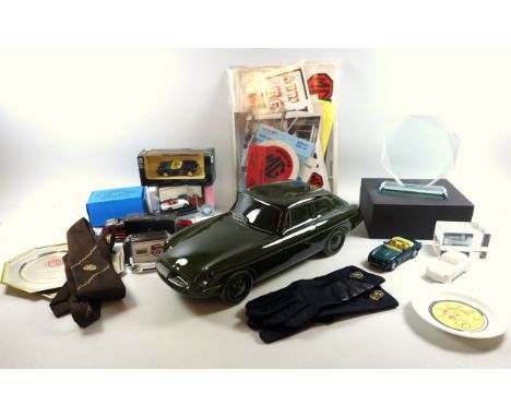 MG car related items to include a Dartmouth pottery green ceramic MG BGT, 38cm, owners club stickers, MG gloves, a boxed rall