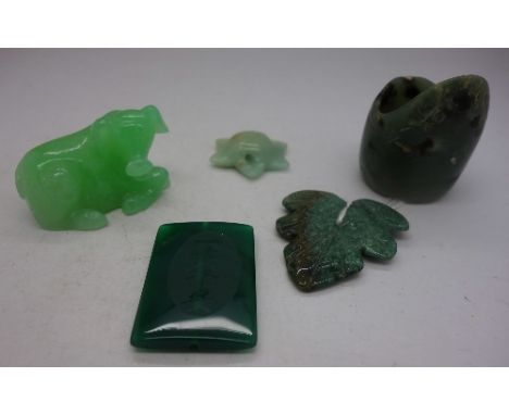 A jade archers ring, a glass figure, etc.