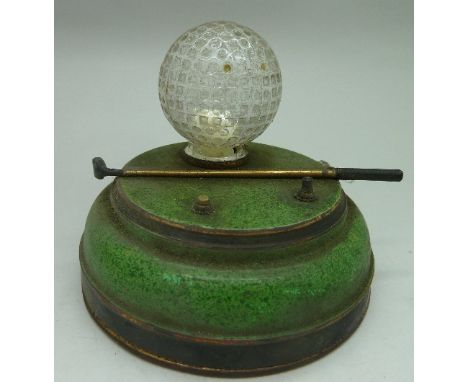 A small tinplate and glass novelty golf lamp, height 8cm