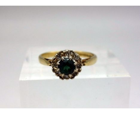 An 18ct gold, diamond and tourmaline ring, weight 2.7g, size K