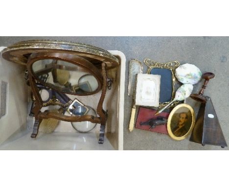 A dressing table mirror, a French metronome, a photograph frame, a pair of opera glasses, a corkscrew, a crumb scoop with ivo