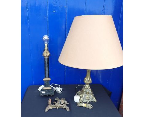 A BRASS TABLE LAMP and a black slate and brass mounted table lamp, both with shades. Provenance: The Estate of the late John 