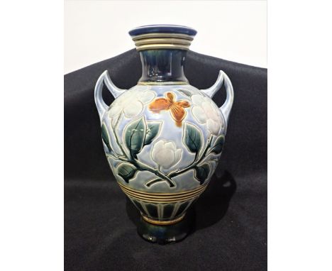 A DOULTON LAMBETH STONEWARE TWO HANDLED VASE decorated by WP with leaves on a light blue ground, 30cm high x 20cm diameter (c