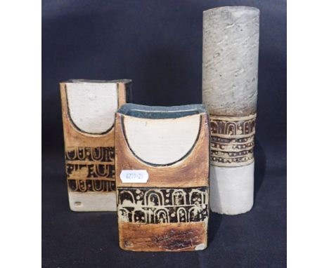 TWO SIMILAR TROIKA STYLE POTTERY SLAB VASES decorated in grey and shades of brown with semi-circles above geometric ornament,