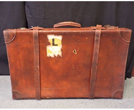 A LEATHER STEAMER TRUNK the locks stamped USA, 47cm high x 75cm wide