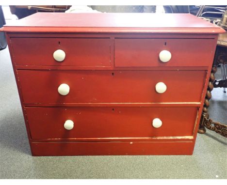 A VICTORIAN RED PAINTED PAINTED CHEST OF DRAWERS with white ceramic knobs, 76cm high x 100cm wide x 50cm deep. Provenance: Th