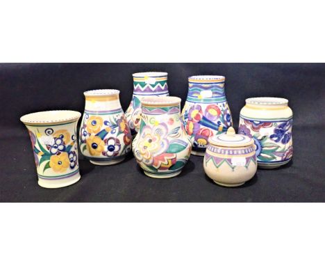 SIX POOLE POTTERY VASES decorated with floral sprays, the tallest 18cm high (one marked Carter Stabler Adams), together with 
