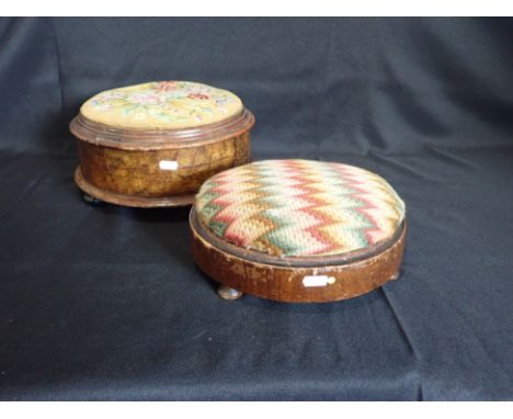 A VICTORIAN FIGURED WALNUT CIRCULAR FOOTSTOOL and a similar smaller ditto, both with tapestry tops (2). Provenance: The Estat