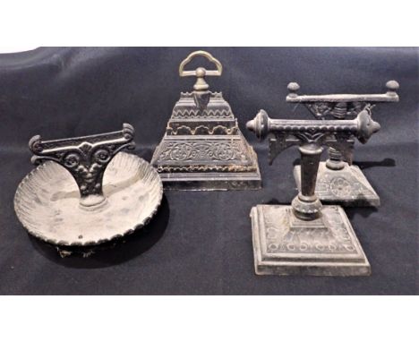 A 19TH CENTURY KENRICK &amp; SONS CAST IRON DOORSTOP designed by Christopher Dresser, of triangular form, 23cm high, No. 438,