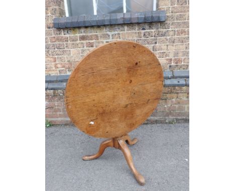 A GEORGE III LIGHT OAK CIRCULAR TRIPOD TABLE reduced in height 77cm dia, 60cm high. Provenance: The Estate of the late John R