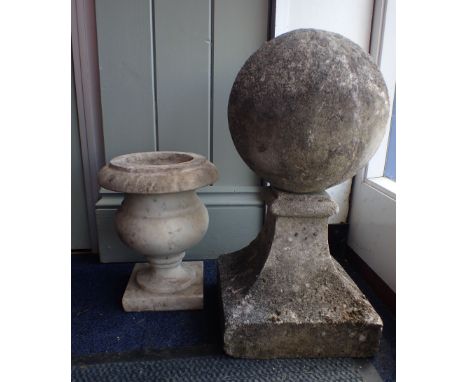 A SMALL MARBLE URN 26cm high (small chips), and a reconstituted pillar finial ball, square based 47cm high (2)