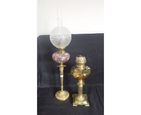 A LATE 19TH CENTURY FRENCH BRASS TABLE OIL LAMP the glass reservoir painted with leaves, on 'candlestick style' tapered reede