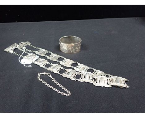AN ART NOUVEAU SILVER BELT with a silver engraved hinged bangle and a silver chain bracelet