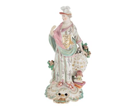 AN 18TH CENTURY DUESBURY &amp; CO DERBY PORCELAIN FIGURE OF MINERVA modelled standing with hoary face shield, hawk and books,