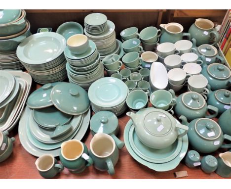 A LARGE QUANTITY OF UTILITARIAN GREEN DINNER WARE and tea ware, by Woods (Beryl), Wedgwood, Poole and Denby (variable used co
