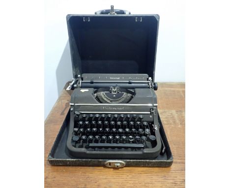 AN UNDERWOOD 'UNIVERSAL' TYPEWRITER cased. Provenance: The Estate of the late John Rollo Somerset-Paddon, formerly of Chalk N