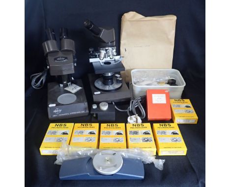 A SWIFT STEREO EIGHTY BINOCULAR ELECTRONIC MICROSCOPE together with a Swift monocular electronic microscope, both with covers