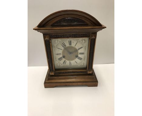 A circa 1900 German mahogany cased mantel clock, the eight day movement with silvered dial and Roman numerals, 33 cm high