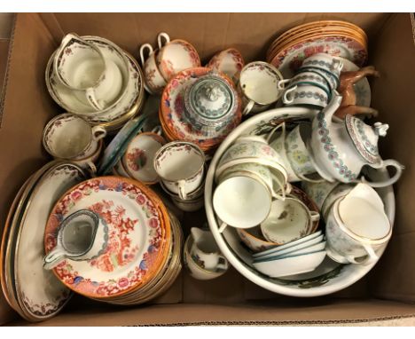 A collection of various china wares to include English chinoiserie decorated oxide red ground teacups, saucers and plates, a 