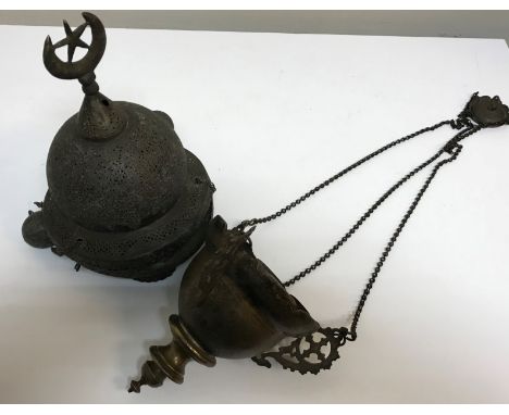 A Turkish pierced brass temple / sanctuary lantern together with another similar, a pair of Middle Eastern copper and white m