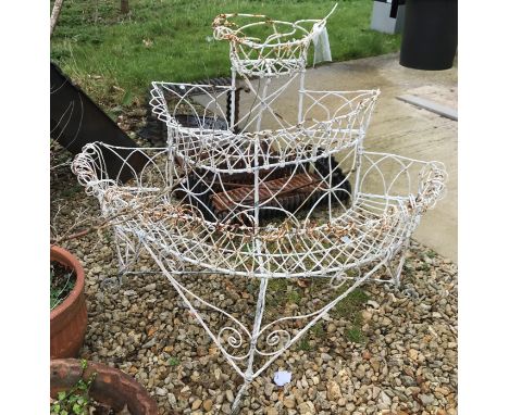 A painted wirework three tier D shaped plant stand, 98 cm wide x 76 cm high